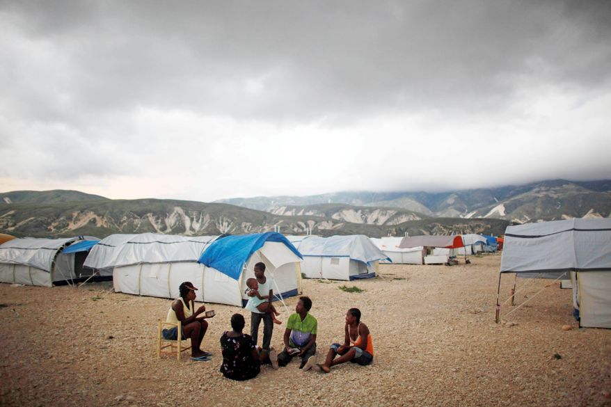 Makeshift slums have sprung up near Corail-Cesselesse, located between the barren mountains and sea north of Port-au-Prince, by people seeking refuge from overflowing camps in the city. (Associated Press)