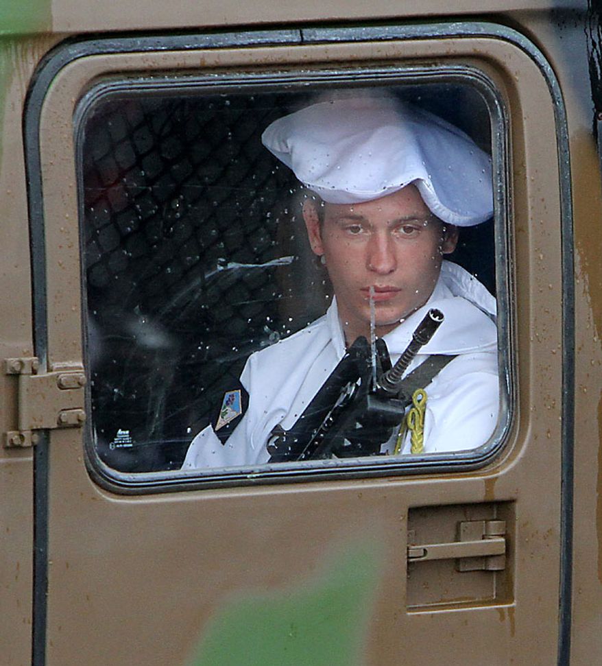 A French soldier rides in a jeep during the annual military parade at the Place de la Concorde during the Bastille Day celebrations in Paris on Wednesday, July 14, 2010. Leaders and soldiers from 13 former French colonies in Africa, celebrating five decades of independence, were invited to take part in this year's parade. (UPI/David Silpa)