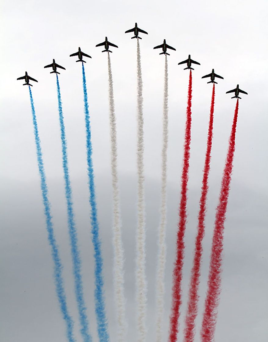 Nine French air force jets fly over the Place de la Concorde during the annual military parade on Bastille Day in Paris on Wednesday, July 14, 2010. Leaders and soldiers from 13 former French colonies in Africa, celebrating five decades of independence, were invited to take part in this year's parade. (UPI/David Silpa)