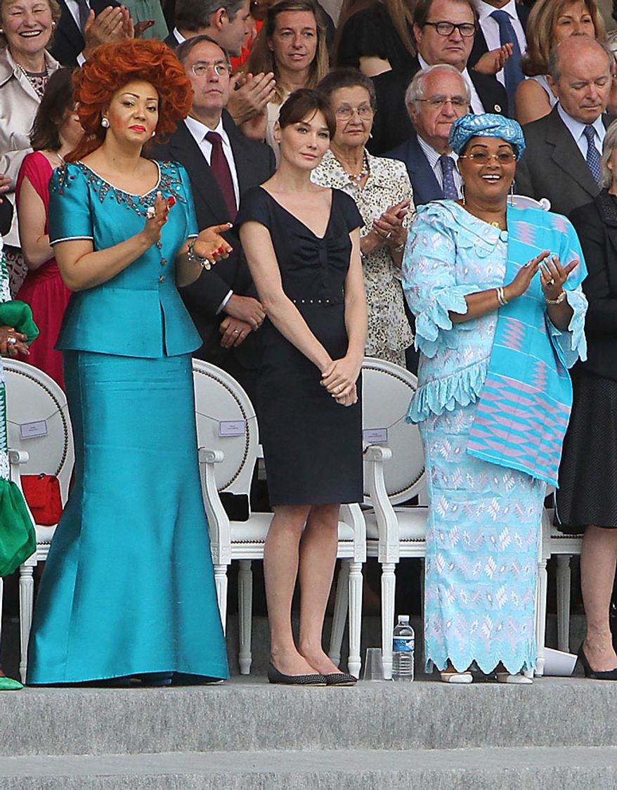 Cameroonian first lady Chantal Biya (left), French first lady Carla Bruni-Sarkozy (center) and Burkina Faso first lady Chantal Compaore watch the annual military parade at the Place de la Concorde during the Bastille Day celebrations in Paris on Wednesday, July 14, 2010. Leaders and soldiers from 13 former French colonies in Africa, celebrating five decades of independence, were invited to take part in this year's parade. (UPI/David Silpa)