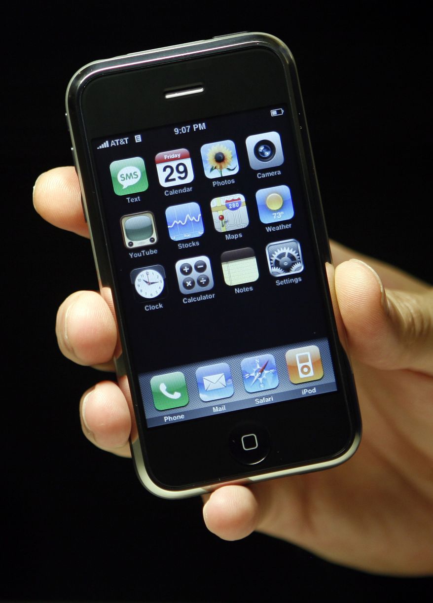 ** FILE ** In this file photo taken June 29, 2010, the Apple iPhone 4 is shown at the Apple Store, in New York. A decision by Consumer Reports not to recommend the iPhone 4 because of reception issues could tarnish Apple Inc.'s reputation, but the snub isn't likely to dissuade fans who have braved poor reception for years. (AP Photo/Jason DeCrow, file)
