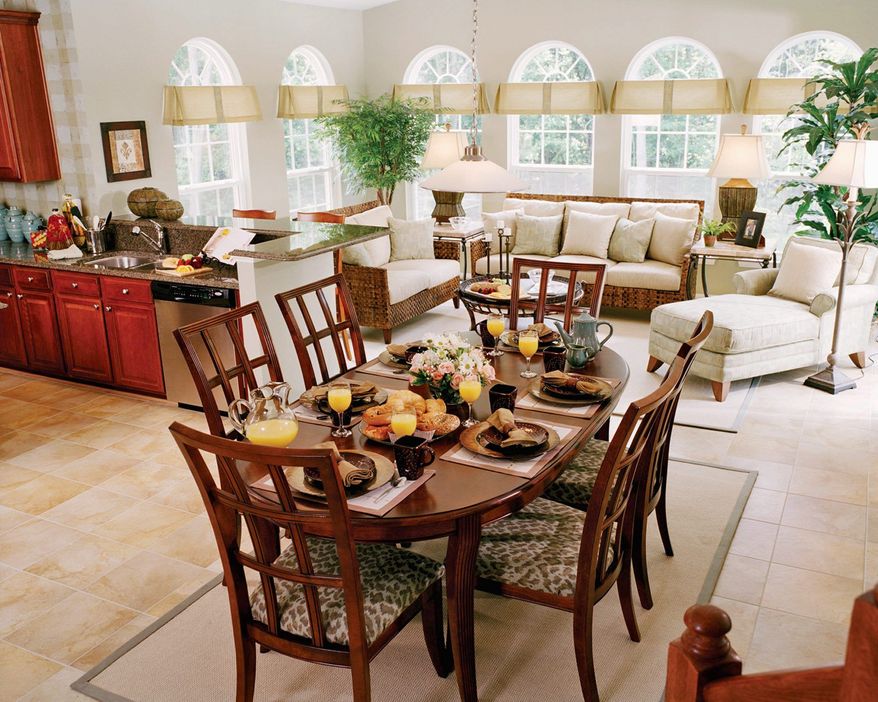 Owners at Timber Village can choose to add a sunroom to the Potomac model, which features a center-island kitchen with a breakfast area. It is priced from $479,900. Four additional models are available.