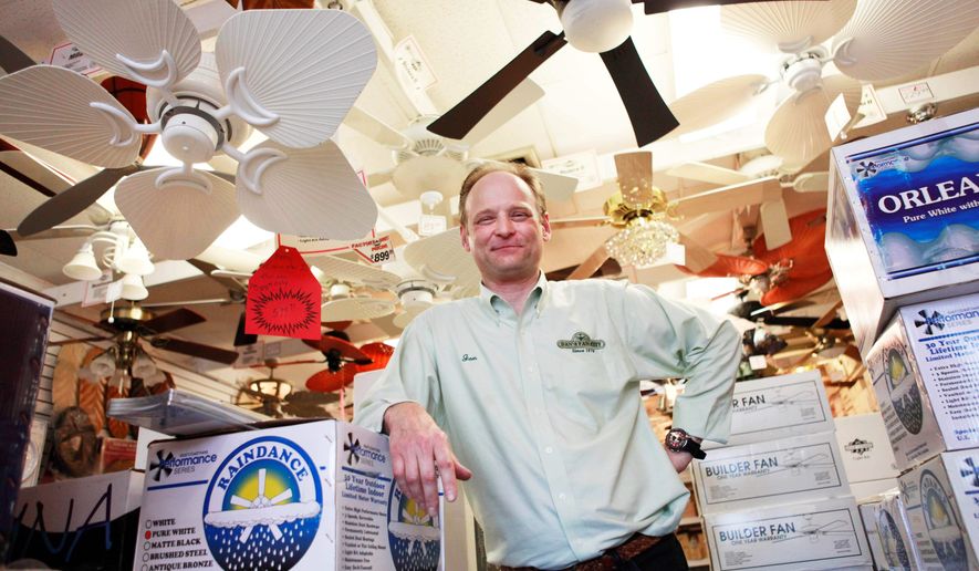 Jon Reeve, manager at Dan's Fan City, is seen at the store in Rockville, Md. on Wednesday, June 16, 2010. Ceiling fans can provide an energy-efficient supplement to air conditioning during these hot summer months. (AP Photo/Jacquelyn Martin)