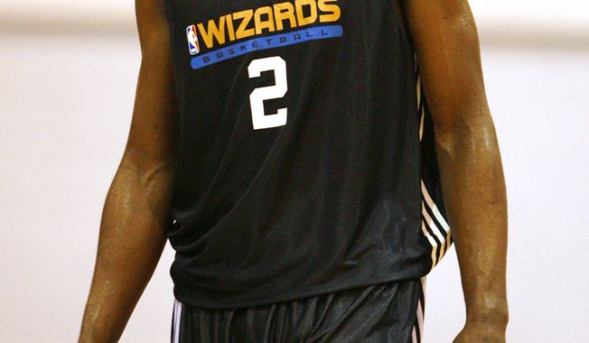 ASSOCIATED PRESS First-round draft pick John Wall of the Washington Wizards smiles as he makes his NBA debut against Golden State Warriors at an NBA summer league basketball game at Thomas &amp; Mack Arena in Las Vegas on Sunday, July 11, 2010.