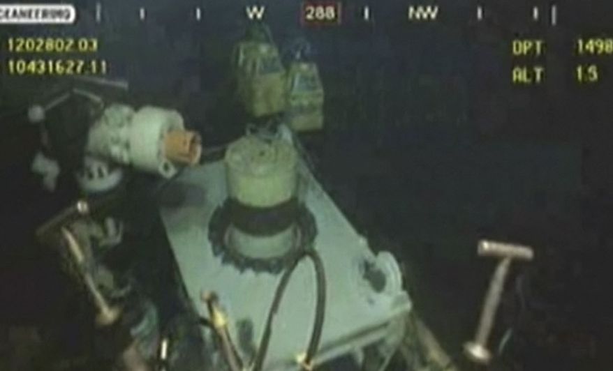 This image taken from video provided by BP PLC at 15:13 CDT shows that oil has stopped flowing from the new 75-ton cap atop the site of the Deepwater Horizon oil spill in the Gulf of Mexico Thursday, July 15, 2010. BP finally choked off the flow of oil into the Gulf of Mexico on Thursday -- 85 days and up to 184 million gallons after the crisis unfolded -- then began a tense 48 hours of watching to see whether the capped-off well would hold or blow a new leak. Engineers will monitor pressure gauges and watch for signs of leaks elsewhere in the well. (AP Photo/BP PLC)