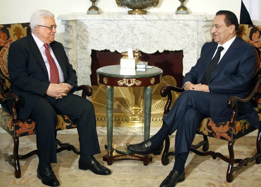 Egyptian President Hosni Mubarak (right) meets with Palestinian Authority President Mahmoud Abbas at the Presidential Palace in Cairo on Sunday, July 18, 2010. Talks come within the framework of efforts aimed at reviving direct negotiations between Israel and Palestinians. (AP Photo/Amr Nabil)
