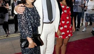Oliver Stone attends the premiere of South of the Border, at the Curzon cinema in Mayfair, central London, with his wife Chong Son Chong (left) and daughter Tara Chong (right) Monday July 19, 2010. (AP Photo / PA) ** UNITED KINGDOM OUT - NO SALES - NO ARCHIVES