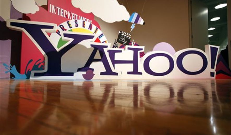 In this Dec. 1, 2010 photo, the Yahoo logo is displayed outside of Yahoo headquarters in Sunnyvale, Calif. Yahoo Inc., releases quarterly financial earnings Tuesday, Jan. 25, 2011, after the market close. (AP Photo/Paul Sakuma)