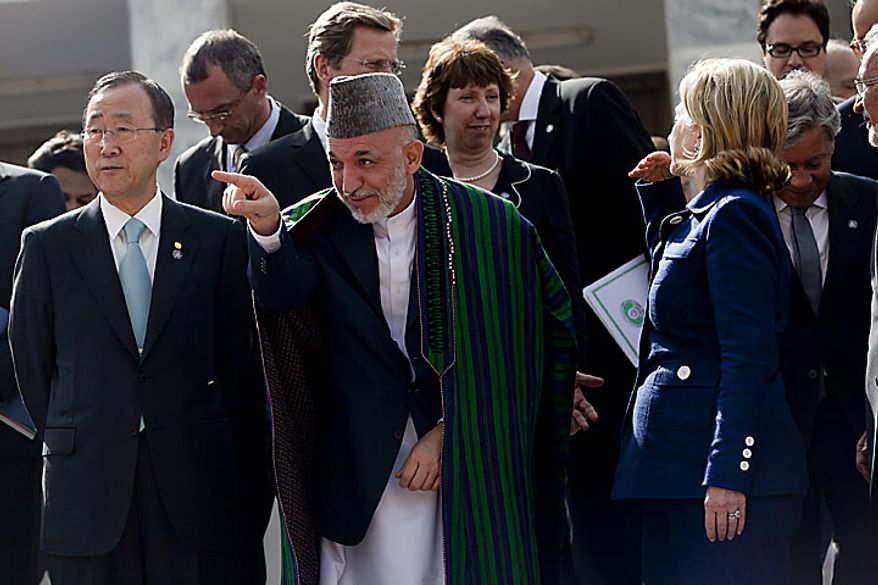 (Front row, from L to R) U.N. Secretary General Ban Ki Moon, Afghan President Hamid Karzai, and U.S. Secretary of State Hillary Clinton pose for photos in Kabul on July 20, 2010. A major international conference in Kabul ended on July 20 calling for at least 50 percent of development aid for the country to be channeled through the Afghan government's budget within two years. UPI/Hossein Fatemi