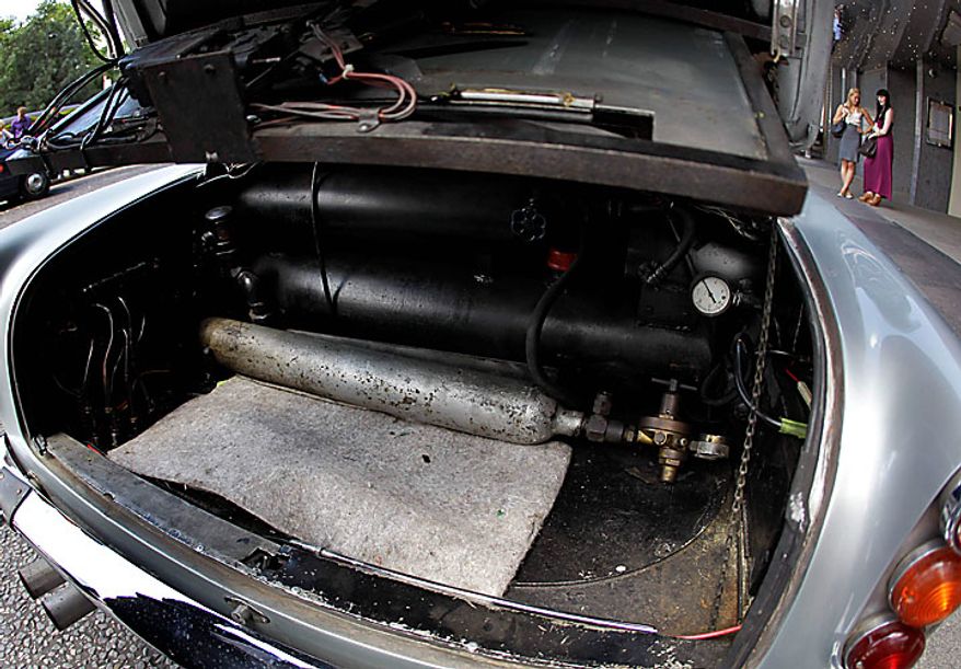 The interior of the boot of the original Aston Martin DB5 driven by Sean Connery in the James Bond films Goldfinger and Thunderball is displayed for the media in London, Wednesday, July 21, 2010. The car is estimated to fetch in the region of $4.6 million when it is sold at auction in London on Oct. 27. (AP Photo/Matt Dunham)