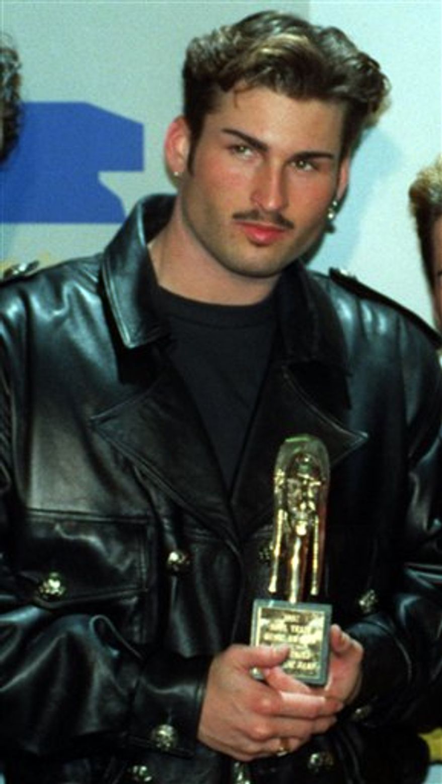 FILE - Bryan Abrams poses backstage at the Sixth Annual Soul Train Awards where his group, "Color Me Badd," won an award for Best R&B/Soul Single by a Group, in Los Angeles, in this March 10, 1992 file photo. Honolulu police say 40-year-old Bryan Abrams was arrested Tuesday July 20, 2010 after getting into an argument with his wife and throwing her across the room. (AP Photo/Doug Pizac, File)