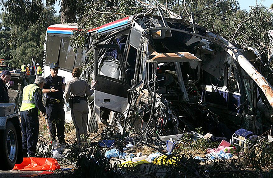 California Highway Patrol investigators work at the scene of the fatal Greyhound bus accident in which at least six people were killed and others injured Thursday, July 22, 2010, in Fresno, Calif. A Greyhound bus traveling to Sacramento from Los Angeles crashed on a highway in California's Central Valley early Thursday morning. (AP Photo/The Fresno Bee, John Walker)