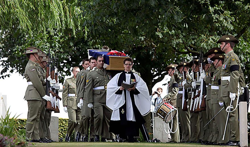Members of the Australian Federation Guard carry the coffin of Australian WWI soldier, Private Alan James Mather, during a re-burial ceremony at Prowse Point Cemetery in Ploegsteert, Belgium, on Thursday, July 22, 2010. Mr. Mather, originally from Invernell, NSW, Australia was one of 216,000 men from Australia, New Zealand and the UK who fought in the Battle of Messines from June 7-14, 1917. (AP Photo/Virginia Mayo)