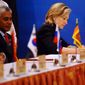 U.S. Secretary of State Hillary Rodham Clinton, right, signs the Treaty of Amity and Cooperation along with others at the end of the 17th ASEAN Regional Forum (ARF), in Hanoi, Vietnam, Friday, July 23, 2010. (AP Photo/Hoang Dinh Nam, Pool)