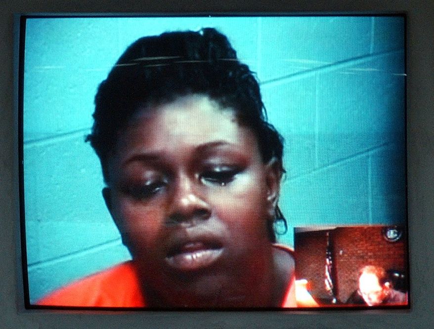 Torrie Emery appears in a video arraignment in Pontiac, Mich. on Friday July 23, 2010. Torrie Emery was charged with second-degree murder, assault and child abuse in a fatal car crash stemming from a dispute on the social networking site Facebook. Police say the 23-year-old woman had her 3-year-old daughter in the car Wednesday afternoon when she rammed a car being driven by Alesha Abernathy of Pontiac. Police said Abernathy's car hit a dump truck while being chased. (AP Photo/The Oakland Press, Vaughn Gurganian)