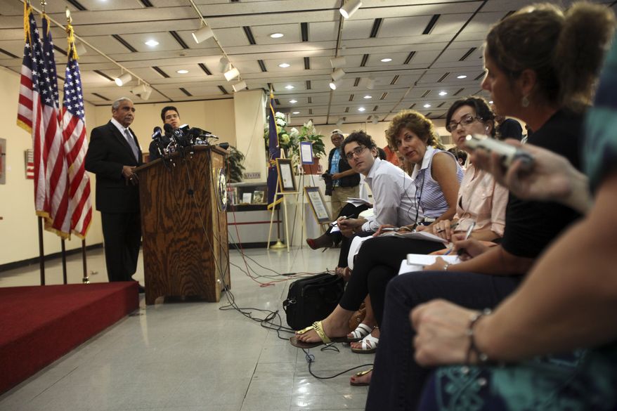 Democratic Rep. Charles B. Rangel, left, speaks to reporters during a news conference Friday, July 23, 2010 in New York. Rangel, once among the most powerful members of Congress, will face a hearing on charges of violating House ethics rules after a panel of his peers formally accused him of wrongdoing Thursday. (AP Photo/Mary Altaffer)