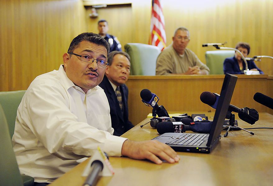 Pedro Carrillo, left, interim city manager of Bell, Calif., announces the resignations of three of Bell's top administrators during a special city council meeting, Thursday, July 22, 2010, in Bell, Calif. Council members emerged from an hours-long closed session at midnight Friday and announced that they'd accepted the resignations of Chief Administrative Officer Robert Rizzo, Assistant City Manager Angela Spaccia and Police Chief Randy Adams. Rizzo was the highest paid at $787,637 a year, nearly twice the pay of President Barack Obama, for overseeing one of the poorest towns in Los Angeles County. Spaccia makes $376,288 a year and Adams earns $457,000, 50 percent more than Los Angeles Police Chief Charlie Beck. (AP Photo/Chris Pizzello)