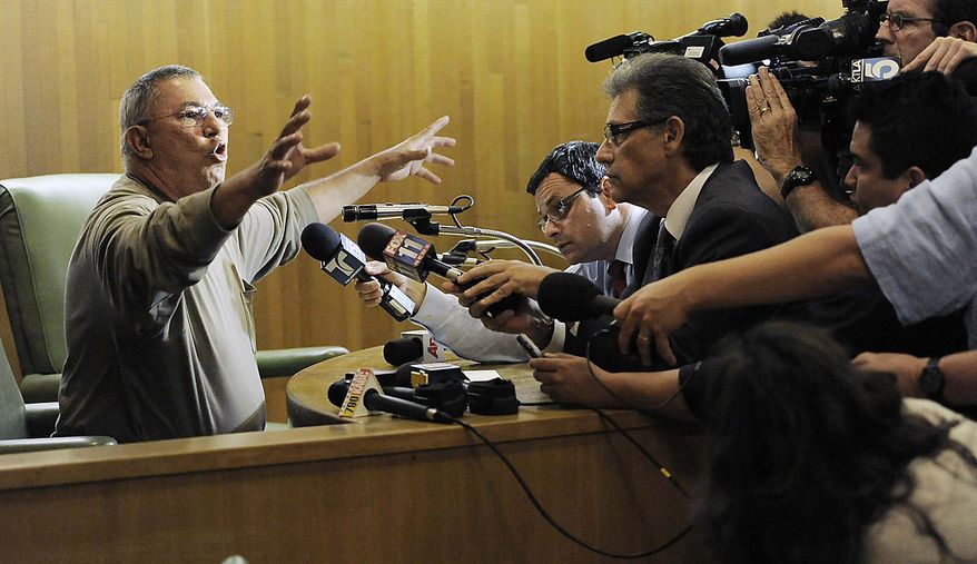 Bell city counselor Lorenzo Velez is interviewed during a break in a special Bell City Council meeting to consider firing the police chief and two top administrators, Thursday, July 22, 2010, in Bell, Calif. Revelations about Bell city leaders' pay has sparked anger in a blue-collar town that is one of the poorest in Los Angeles County. (AP Photo/Chris Pizzello)