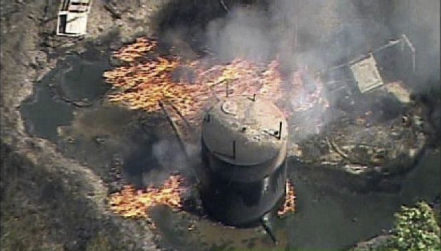 In this frame grab image provided by video from WPXI-TV, a fire rustling from a natural gas well explosion burns in Indianola, Pa., northeast of Pittsburgh on Friday, July 23, 2010. Police reported two persons killed. (AP Photo/WPXI)