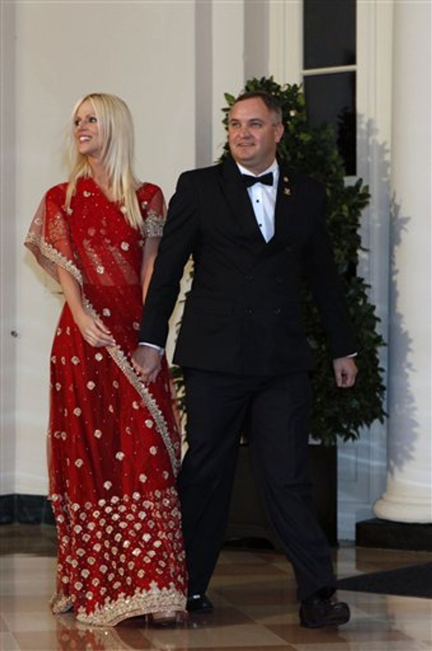 FILE - In this Tuesday, Nov. 24, 2009 file photo, Michaele and Tareq Salahi, right, arrive at a State Dinner at the White House in Washington. Salahi tells the AP in an interview that her new show, "The Real Housewives of D.C.," will show that she and her husband, Tareq, are "not just two people who went to a dinner." (AP Photo/Gerald Herbert, file)
