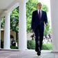 WALKING TALL: President Obama makes an exit after delivering a statement in the Rose Garden at the White House on Monday. Mr. Obama pushed for a Senate measure that would require more disclosure on campaign contributions. (Bloomberg)