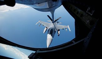 A KC-135 Stratotanker from the 909 Air Fueling Squadron of the 18th Wing of the U.S. Air Force, based in Japan&#x27;s Kadena, conducts aerial refueling to a F-16 Fighting Falcon from the U.S. Seventh Air Force&#x27;s 8th Fighter Wing, based in South Korea&#x27;s Gunsan, during a joint military drills between South Korea and the U.S. over the East Sea, east of Seoul, South Korea, Monday, July 26, 2010. (AP Photo/Lee Jae-won, Pool)