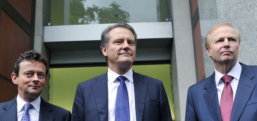From left, outgoing BP CEO Tony Hayward, Chairman Carl-Henric Svanberg and incoming CEO Bob Dudley announce the naming of the new chief executive officer outside global headquarters in London on Tuesday. (Associated Press)