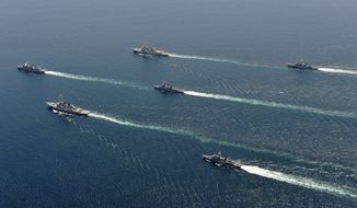 South Korean and U.S. warships participate in joint military drills in the East Sea/Sea of Japan off the Korean peninsula on Tuesday, July 27, 2010. The ships fired artillery and dropped anti-submarine bombs off South Korea&#39;s east coast Tuesday, the third day of high-profile military maneuvers intended to warn North Korea against any aggression. (AP Photo/Korean Navy via Yonhap)