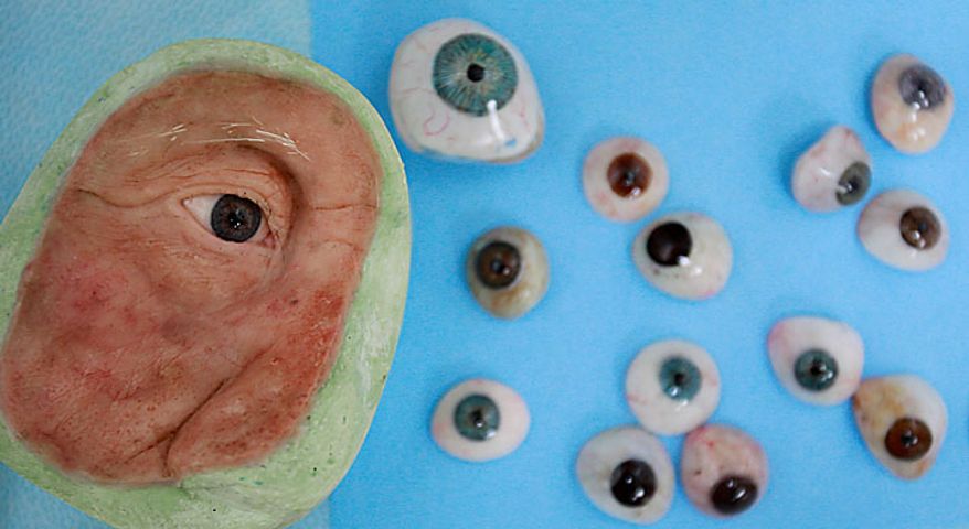 In this photo taken June 23, 2010, a facial prosthetic and artificial eyes are seen in a facial prosthetics lab at Wilford Hall Medical Center in San Antonio. (AP Photo/Eric Gay)