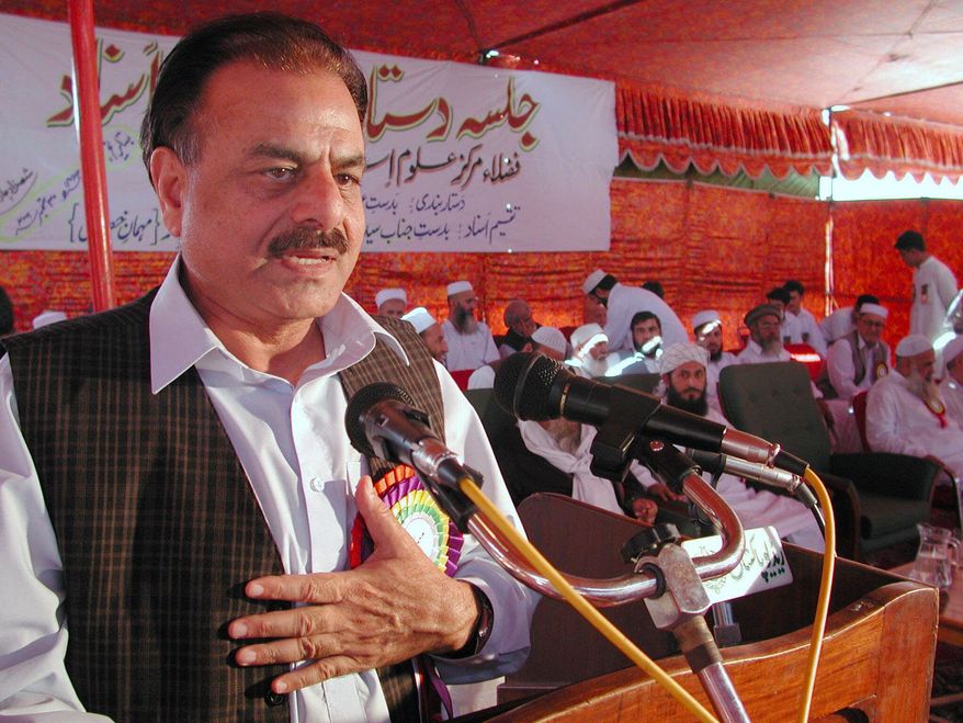 **FILE** Retired Gen. Hamid Gul, former Chief Inter Services Intelligence, addresses students of a Dar-ul-Alumi-Islami, Islamic religious school during a graduation ceremony in Peshawar, Pakistan on Sept. 30, 2001. (Associated Press)