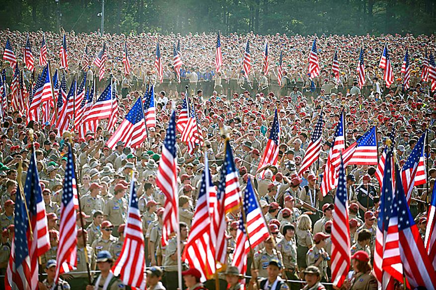 In a Wednesday, July 28, 2010 photo provided by the Department of Defense, Boy Scouts from across America march with flags for the playing of the national anthem during the Boy Scouts of America 2010 National Scout Jamboree at Ft. AP Hill, Va. U.S. Defense Secretary Robert Gates addressed an audience of more than 45,000 who came to the 12,000 acre site for 10 days to celebrate the Boy Scouts' 100-year anniversary. (AP Photo/DOD, Cherie Cullen)