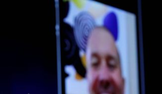 Associated Press
Apple CEO Steve Jobs (left) talks to a friend using the FaceTime video chat feature on the iPhone 4 during the Apple Worldwide Developers Conference in June. Adult-entertainment companies are developing video-sex-chat services to use with FaceTime.