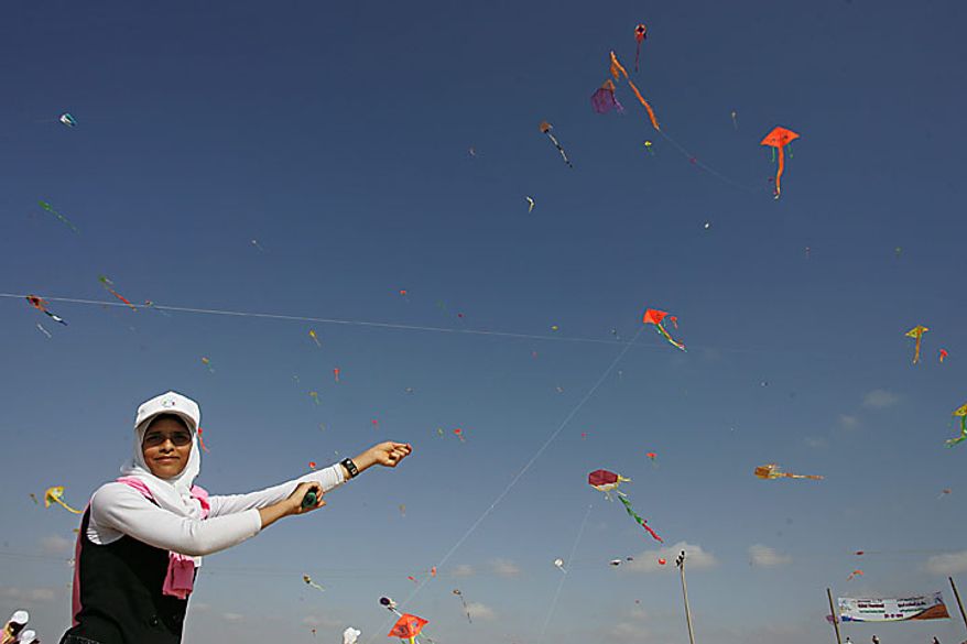 Thousands of Palestinian children fly kites along the beach during a UN-sponsored summer camp in the northern Gaza on, July 29, 2010. Palestinian children in the impoverished Gaza claimed a world record, flying hundreds of kites at the same time on a northern beach of Gaza. 8,000 children attend in the event, Khalil el-Halabi, education program head at the United Nations Relief and Works Agency (UNRWA) said. UPI/Ismael Mohamad.