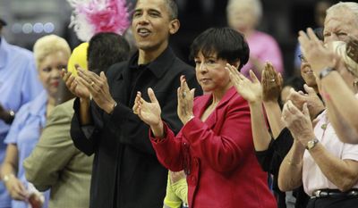 ASSOCIATED PRESS President Barack Obama, left, and Washington Mystics part owner Sheila Johnson, center right, applaud as the WNBA game between the Washington Mystics and Tulsa Shock begins Sunday, Aug. 1, 2010, in Washington.