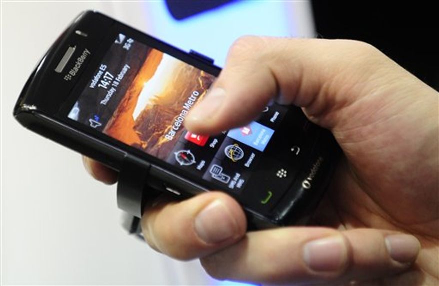 FILE - In this Feb. 18, 2010 file photo, a BlackBerry smart phone is displayed at the Mobile World congress in Barcelona, Spain. The UAE said Sunday, Aug. 1, 2010 it will block key features on BlackBerry smart phones, citing national security concerns because the devices operate beyond the government's ability to monitor their use. Neighboring Saudi Arabia quickly indicated it planned to follow suit. (AP Photo/Manu Fernandez, File)