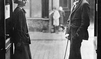 James Joyce and Sylvia Beach outside the door of Shakespeare and Company on the Rue de l&#39;Odeon in Paris in 1920