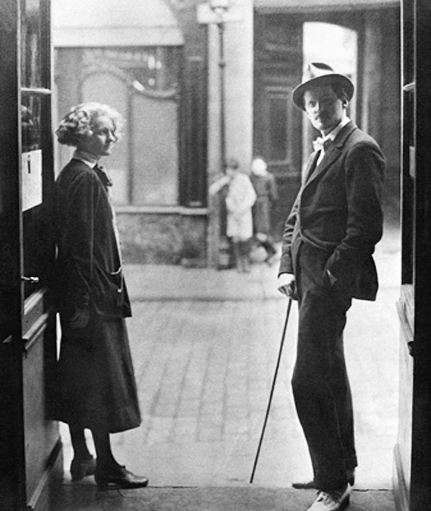 James Joyce and Sylvia Beach outside the door of Shakespeare and Company on the Rue de l'Odeon in Paris in 1920