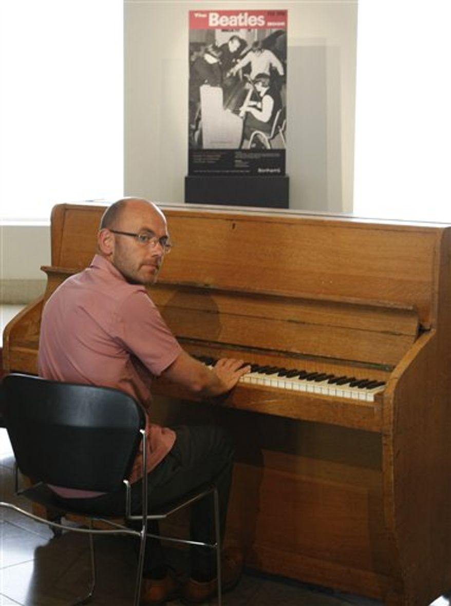 A Cullen upright piano is seen at Bonhams auction house, that comes form the world famous Abbey Road recording studios in London, Monday, Aug. 2, 2010. The piano played by artists from the Beatles to Pink Floyd, including their Dark Side of the Moon album, is estimeted at 100-150,000 pounds, (US$ 157-230,000) it goes on sale on Aug.15.(AP Photo/Alastair Grant)