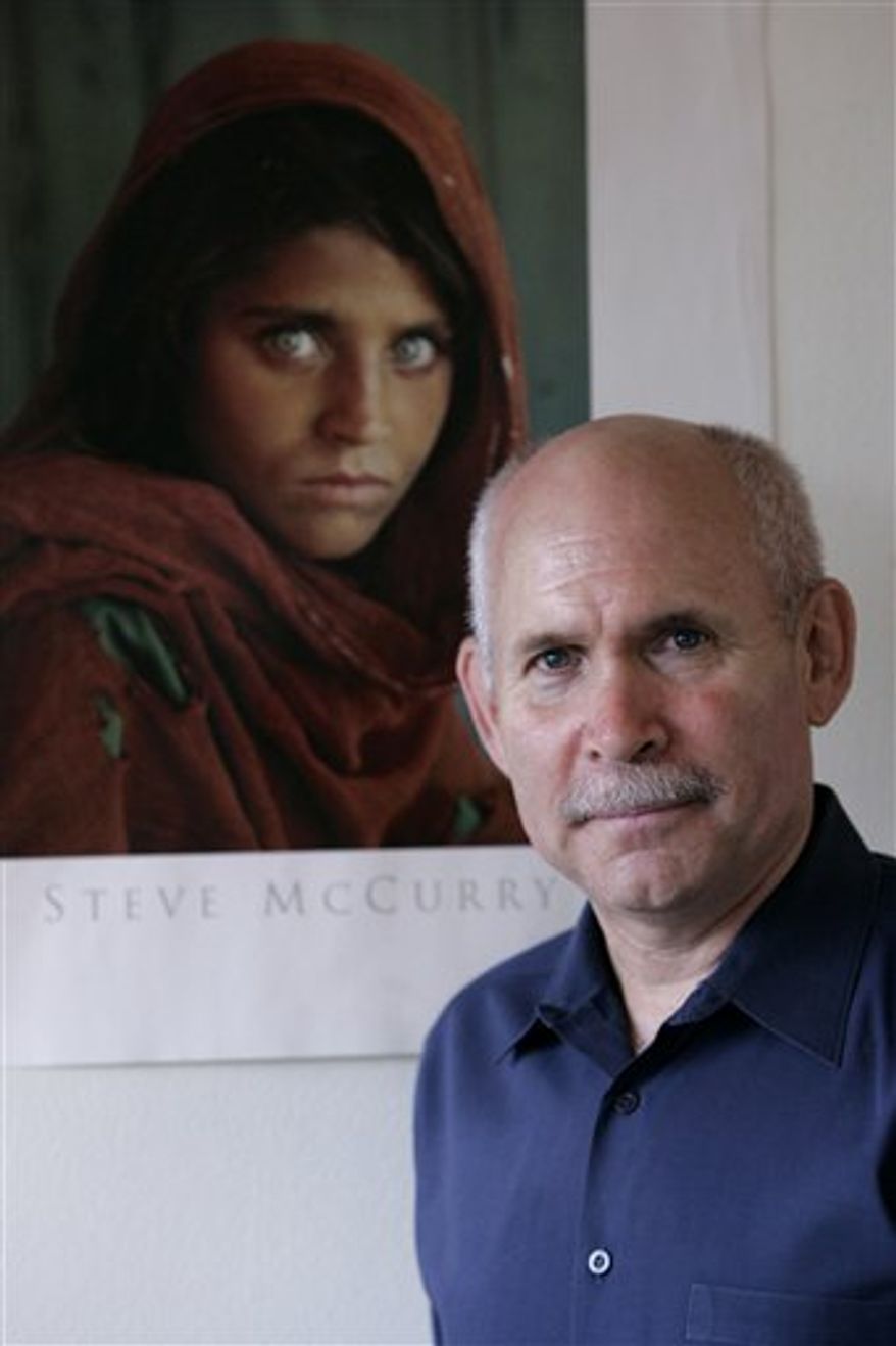 In this June 2010 photo released by National Geographic Television, photographer Steve McCurry takes a photo of a Bollywood actor in Mumbai, India, with the last Kodachrome roll. Betting its future on digital photography, Kodak discontinued the slide and motion-picture film with a production run last August in which a master sheet nearly a mile long was cut up into more than 20,000 rolls. McCurry requested the final 36-exposure strip. After nine months of planning, he embarked in June on a six-week odyssey. Trailing him was a TV crew from National Geographic Channel, which plans to broadcast a one-hour documentary early next year. (AP Photo/National Geographic Television, Yvonne Russo) ONE-TIME EXCLUSIVE USE; NO SALES; NO TRANSFERS