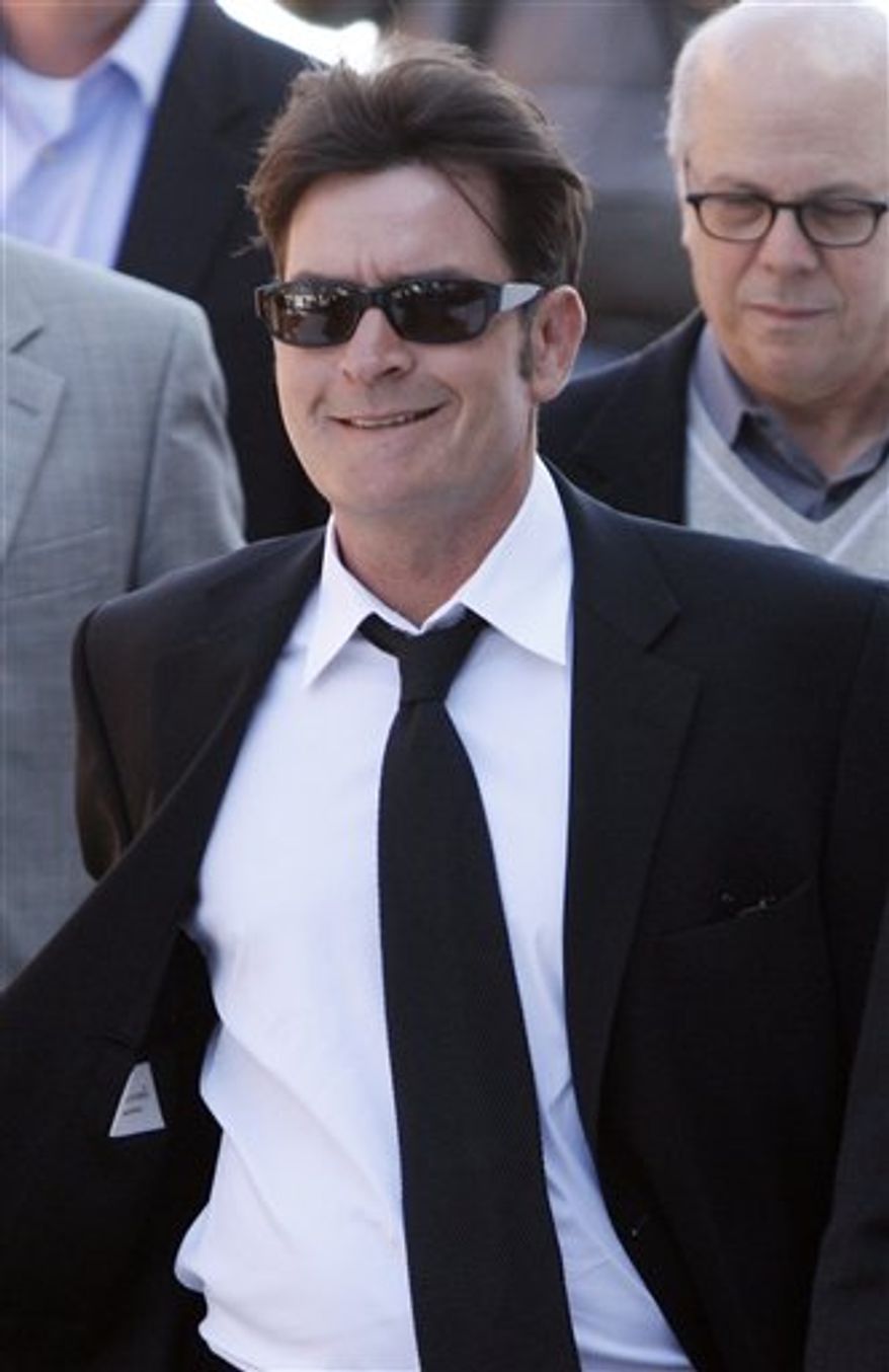 FILE - In this Jan. 28, 2009 file photo, actor Charlie Sheen is interviewed at an event to celebrate Planet Hollywood's purchase of Italian restaurant chain Buca di Beppo, at Universal CityWalk in Los Angeles. (AP Photo/Chris Pizzello, File)