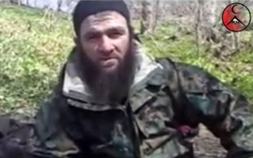 This undated frame grab image taken from files made available by IntelCenter and taken from a video posted on a pro-rebel Web site Wednesday March 31, 2010, purports to show Chechen militant leader Doku Umarov. The leader of Chechnya's separatist militants, who claimed responsbility for the Moscow subway bombings that killed 40 people in March, has announced in a purported video posted on YouTube on Sunday, Aug. 1, 2010, that he is stepping down. (AP Photo/IntelCenter, File)