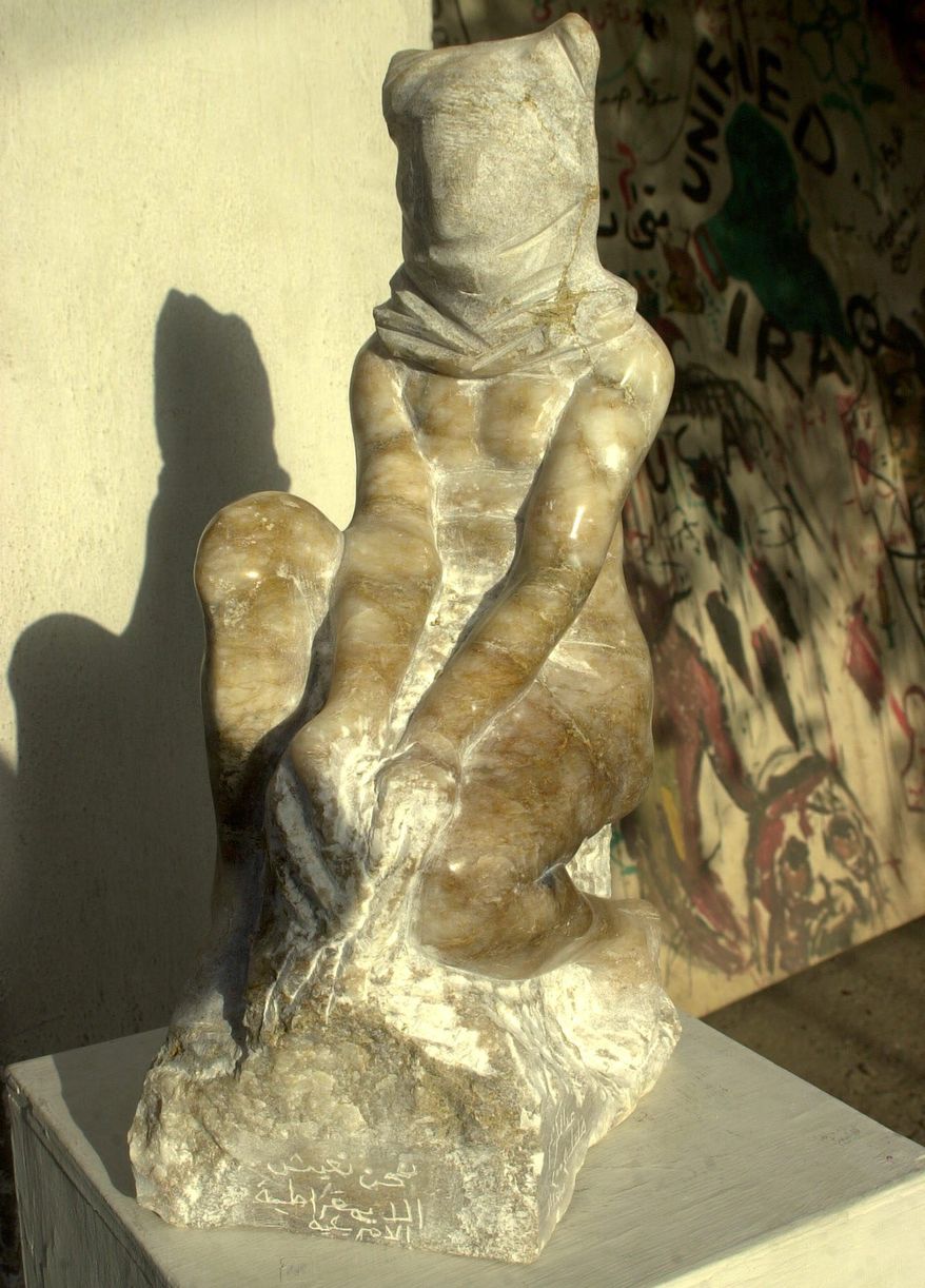 A sculpture, which bears a resemblance to photographs from Abu Ghraib prison, made by artist Abdul-Kareem Khalil in 2004, is on display at a gallery in Baghdad. (Associated Press)