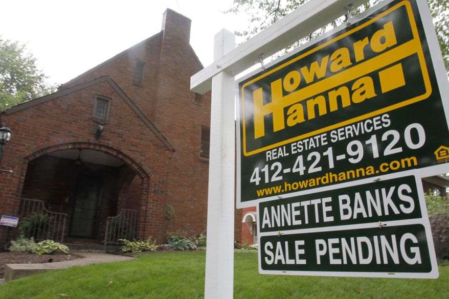 The sale of a home in the Point Breeze section of Pittsburgh is pending in mid-June. (AP Photo/Gene J. Puskar)
