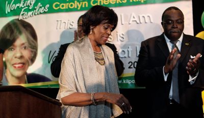 Associated Press
U.S. Rep. Carolyn Cheeks Kilpatrick, Michigan Democrat, leaves after delivering her concession speech Wednesday morning. Mrs. Cheeks Kilpatrick lost her bid for an eighth term on Tuesday, becoming the sixth incumbent to lose a bid so far this year.