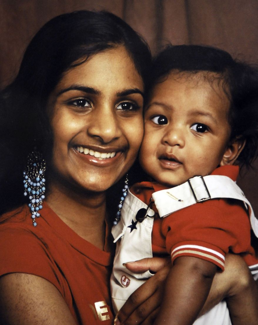 ** FILE ** In this Feb. 14, 2006 file photo released by Seeta Khadan-Newton, Ria Ramkissoon holds her son Javon Thompson. Ms. Ramkissoon, who starved her 1-year-old son to death while part of a religious cult, will be back in court in Baltimore for a hearing to determine how she's faring at a residential treatment center. (AP Photo/Seeta Khadan-Newton, file)