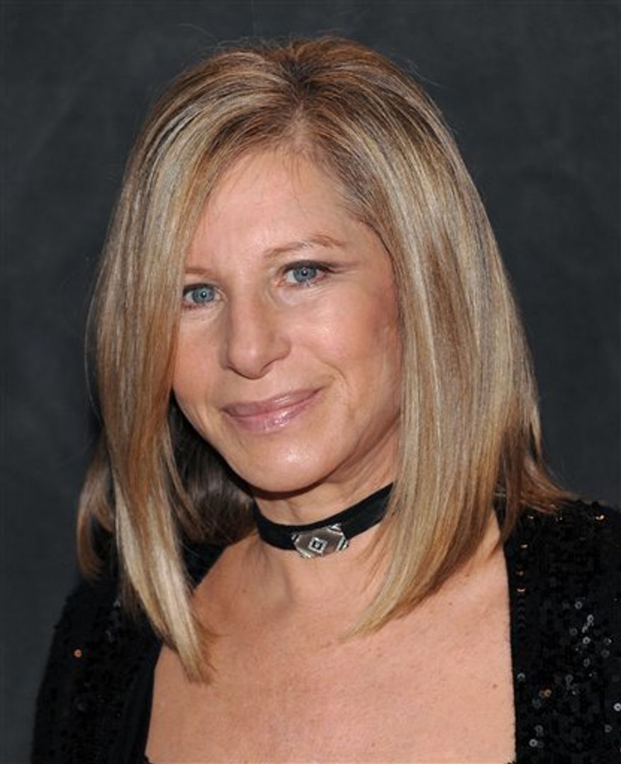 ** FILE ** In this Sept. 26, 2009, file photo, singer Barbra Streisand poses at the Waldorf-Astoria following her performance at the Village Vanguard in New York. (AP Photo/Evan Agostini, File)