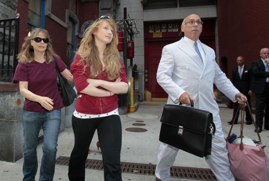 Caroline Giuliani (center), 20, and her mother, Donna Hanover, leave the 19th Precinct police station in New York on Wednesday, Aug. 4, 2010. A law enforcement official said Miss Giuliani, Rudy Giuliani's daughter, was arrested after she was seen on video pocketing makeup at a cosmetic store. (AP Photo/Frank Franklin II)