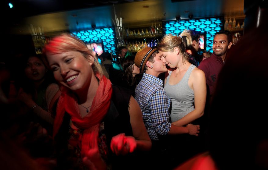 Lauren von Koss, right, and girlfriend Kade Bailey celebrate in the Castro district of San Francisco following a federal judge's decision to overturn California's same-sex marriage ban on Wednesday, Aug. 4, 2010. (AP Photo/Noah Berger)