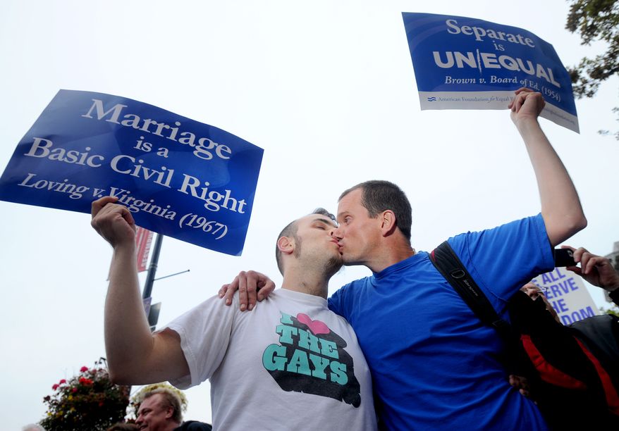 David Herman, right, kisses Jeff Hannan while celebrating a federal judge's decision overturning California's same-sex marriage ban on Wednesday, Aug. 4, 2010, in San Francisco. Chief U.S. District Judge Vaughn Walker made his ruling in a lawsuit filed by two gay couples who claimed the voter-approved ban violated their civil rights. (AP Photo/Noah Berger)