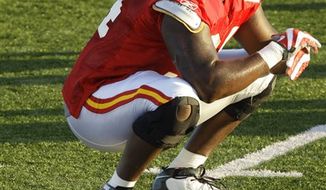 Kansas City Chiefs defensive end Tyson Jackson stretches during NFL football training camp in St. Joseph, Mo., Wednesday, Aug. 4, 2010. (AP Photo/Orlin Wagner)
